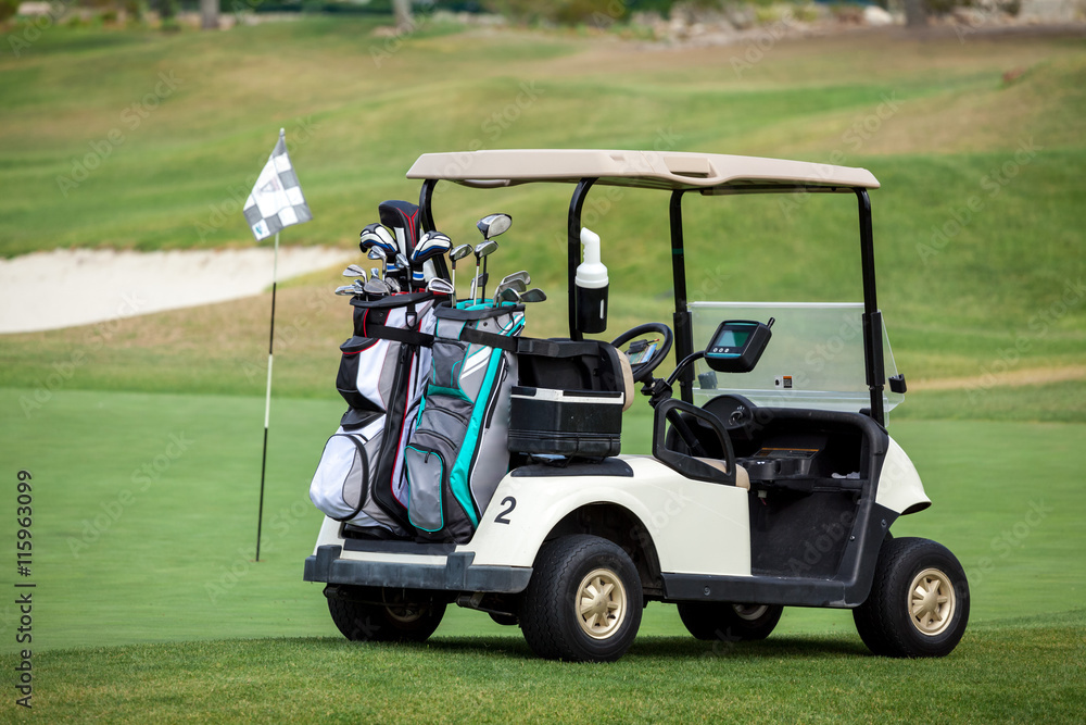 Golf cart on golf course.