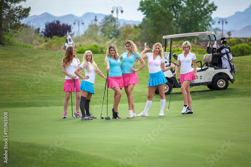 Group of young female golf caddies on golf course. © BestStockFoto