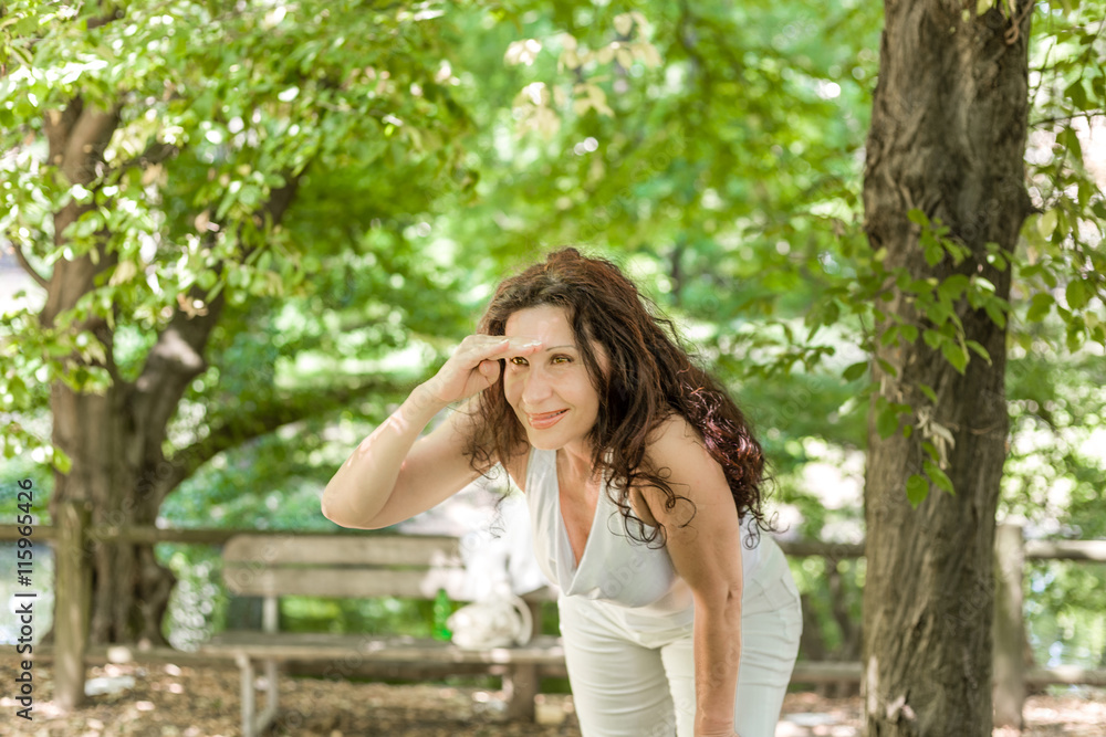 menopausal woman looks into the distance menopausal woman looks into the distance