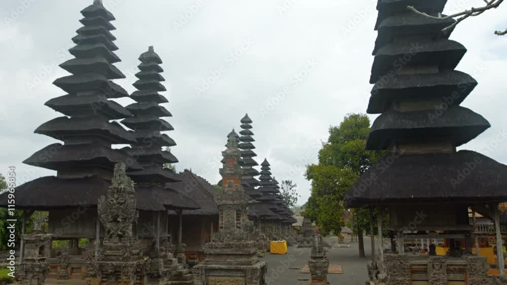 Tiered pagodas of Taman Ayun Royal Temple complex, an important Hindu religious site with ancient stone carvings in Bali, indonesia.