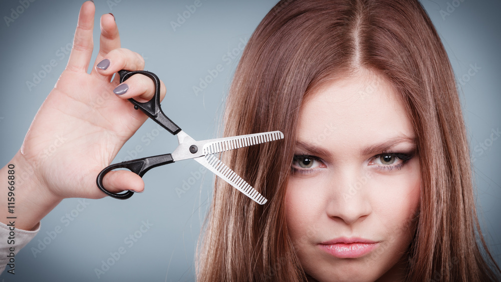 Professional hairdresser dual wielding scissors. Professional hairdresser dual wielding scissors.
