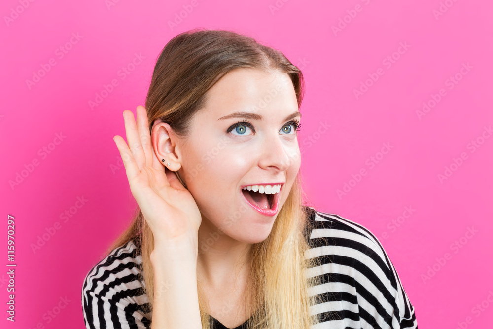 Fototapeta premium Young woman listening