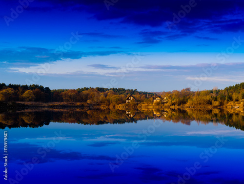 Horizontal vivid vibrant dramatic house on river reflections l