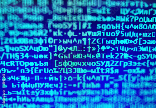 Blue hacker code on display console bokeh backdrop