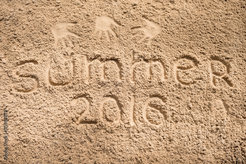 summer 2016 - an inscription a hand on sea sand