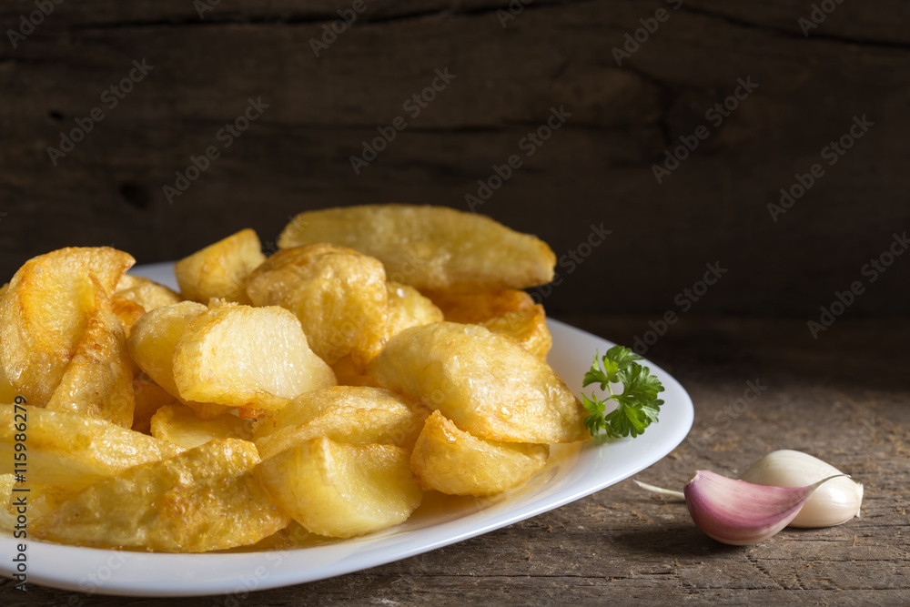 Portion of homemade french fries (potatoes) Portion of homemade french fries (potatoes)