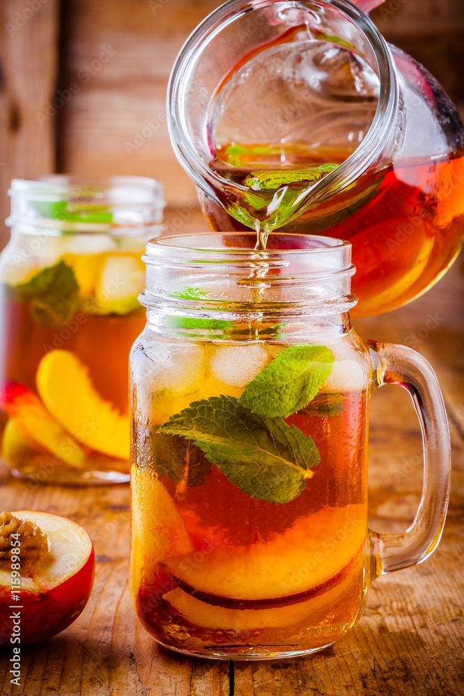 Peach ice tea in mason jar with mint Peach ice tea in mason jar with mint