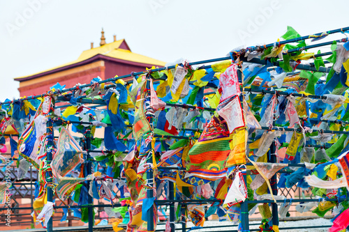 Prayer flags and Hadak at sunset in the Republic of Buryatia. Datsan Rinpoche Bagsha on Bald Mountain in Ulan-Ude, Russia.