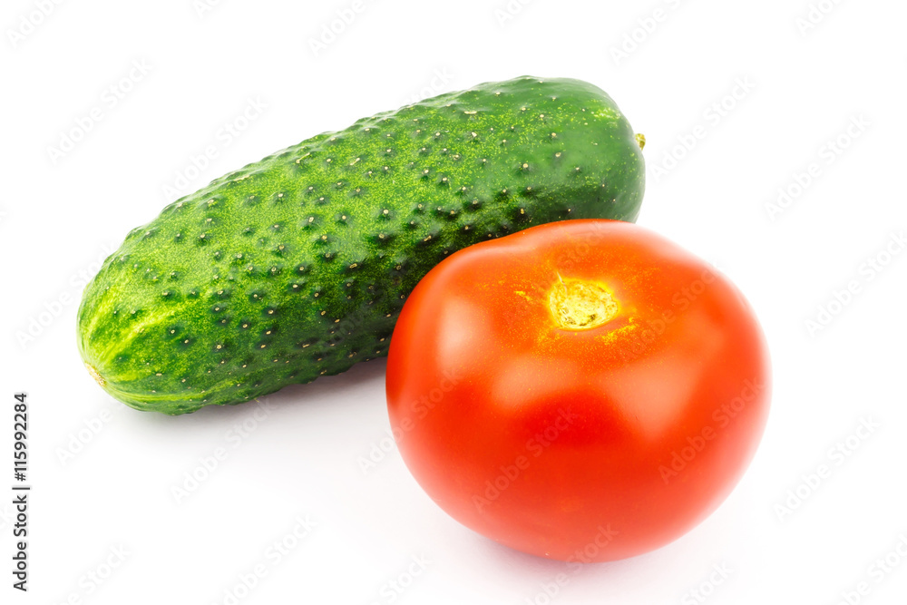 Tomato and cucumber isolated on white background. Tomato and cucumber isolated on white background.