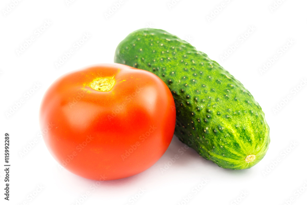 Tomato and cucumber isolated on white background. Tomato and cucumber isolated on white background.