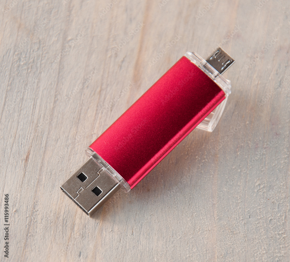 Red USB flash drive . double-sided . Two sockets Stock Photo | Adobe Stock