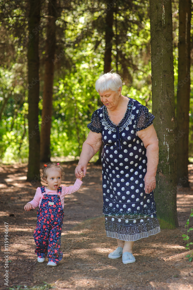 Grandmother and granddaughter walk in the park Grandmother and granddaughter walk in the park