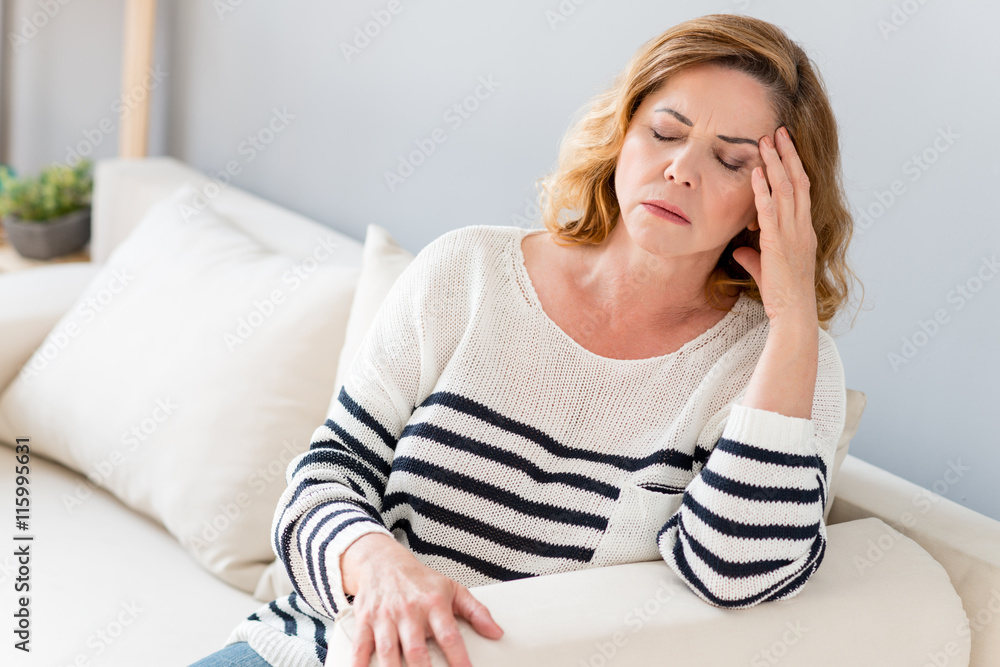 Senior lady feels pain in head