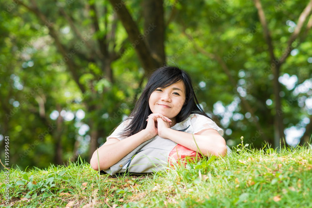Free time of beautiful girl with backpack in central public park Free time of beautiful girl with backpack in central public park