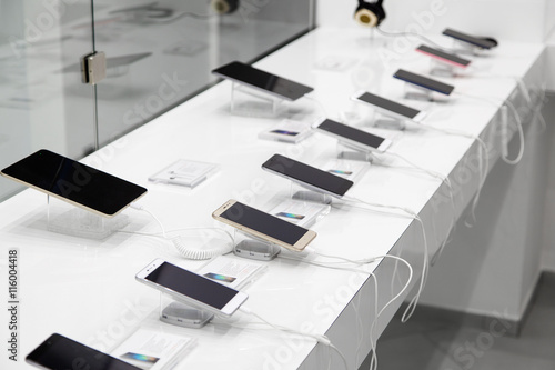 Several smartphones and tablets with the anti-theft devices in the store