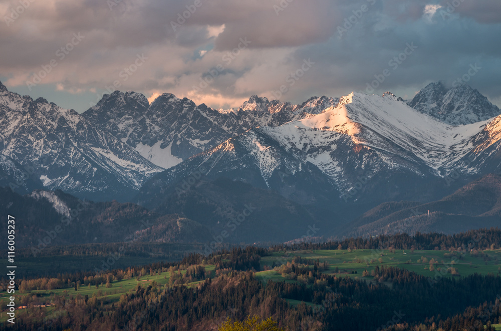 Fototapeta premium Cloudy Tatra mountains in the morning, covered with snow