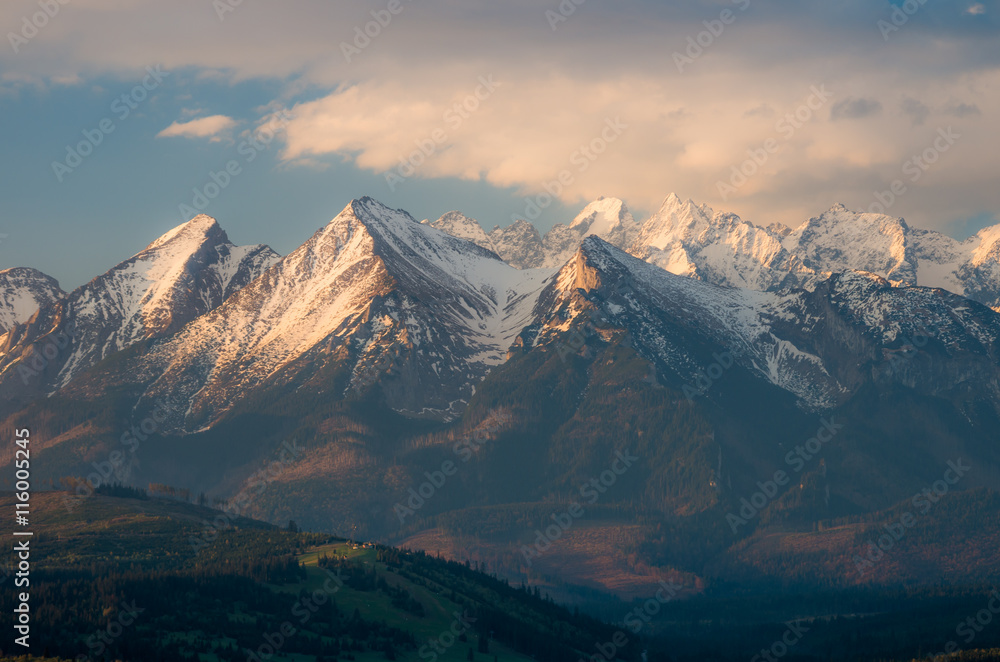 Fototapeta premium Cloudy Tatra mountains in the morning, covered with snow