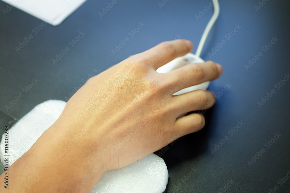 Man's hand clicking a computer mouse white. Man's hand clicking a computer mouse white.