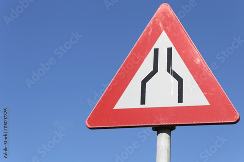 Fotografi Dutch road sign: road narrows on both sides