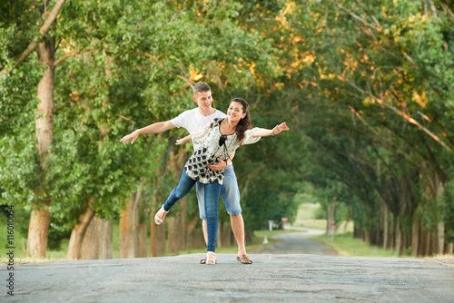 happy young couple walk on country road outdoor, romantic people concept, summer season