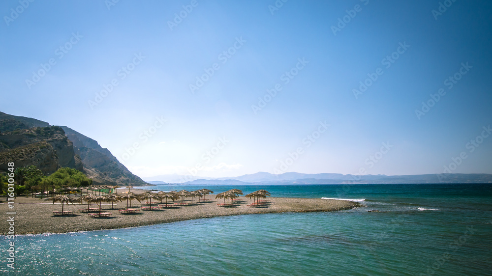 custom made wallpaper toronto digitalStraw umbrella on a sandy beach in Greece. Beach chairs with umbrellas on a beautiful beach in Crete island.