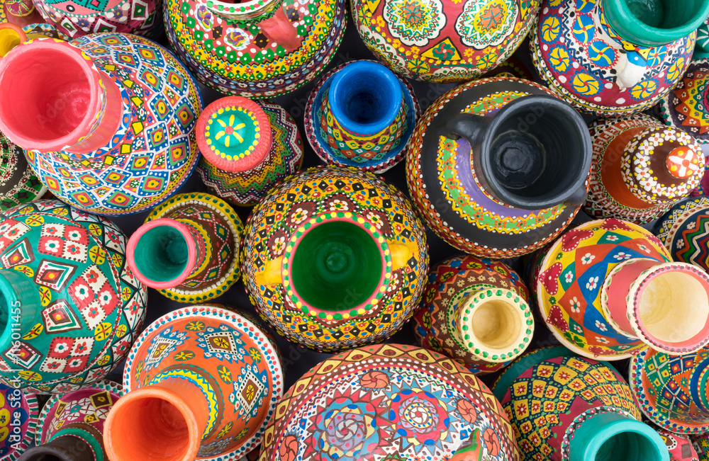 Composition of artistic painted handcrafted pottery jars