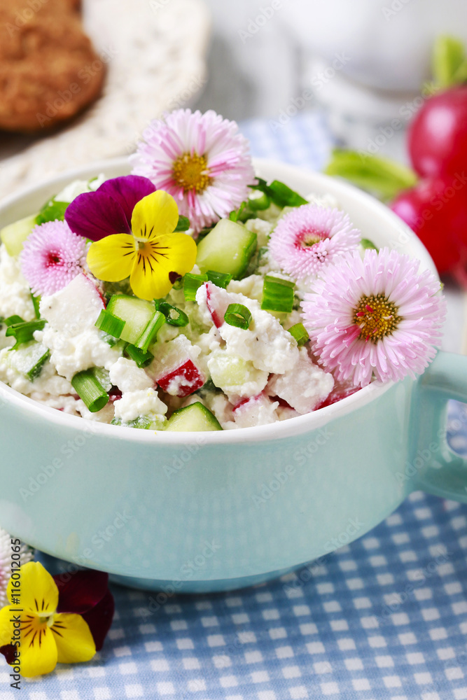 Healthy salad with vegetables and edible flowers
