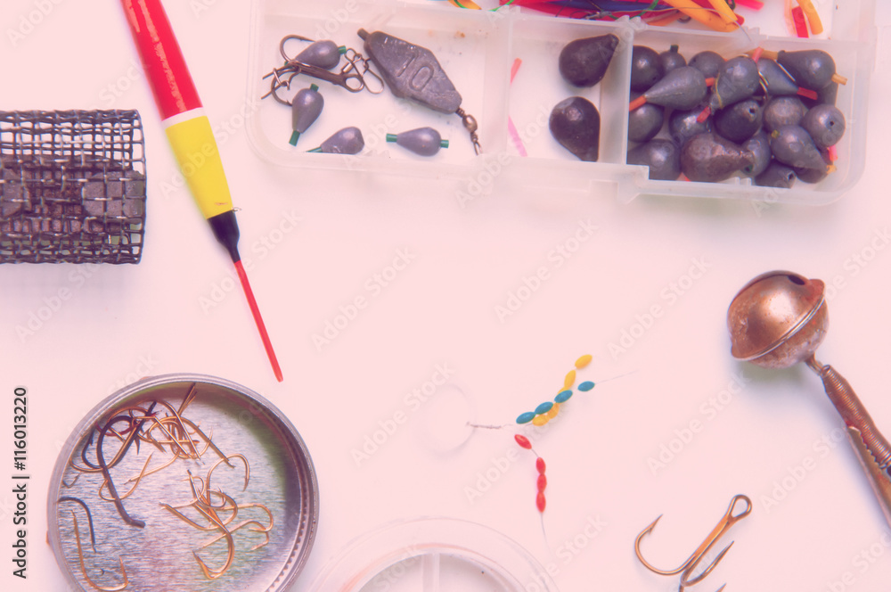 Fishing baits and equipment isolated on white background Fishing baits and equipment isolated on white background