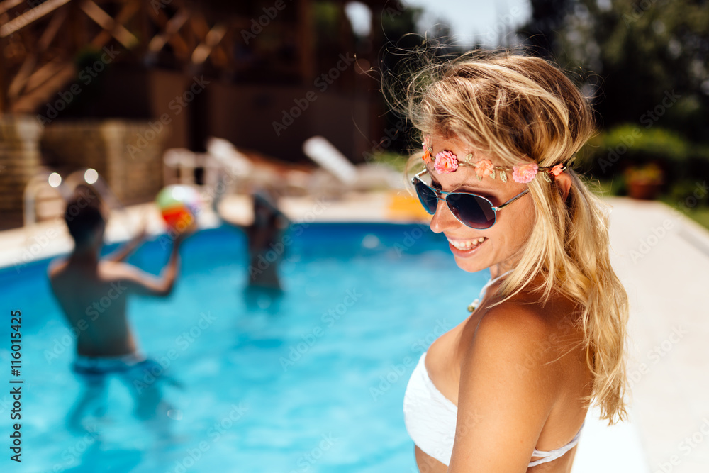 Woman enjoying summer at pool side