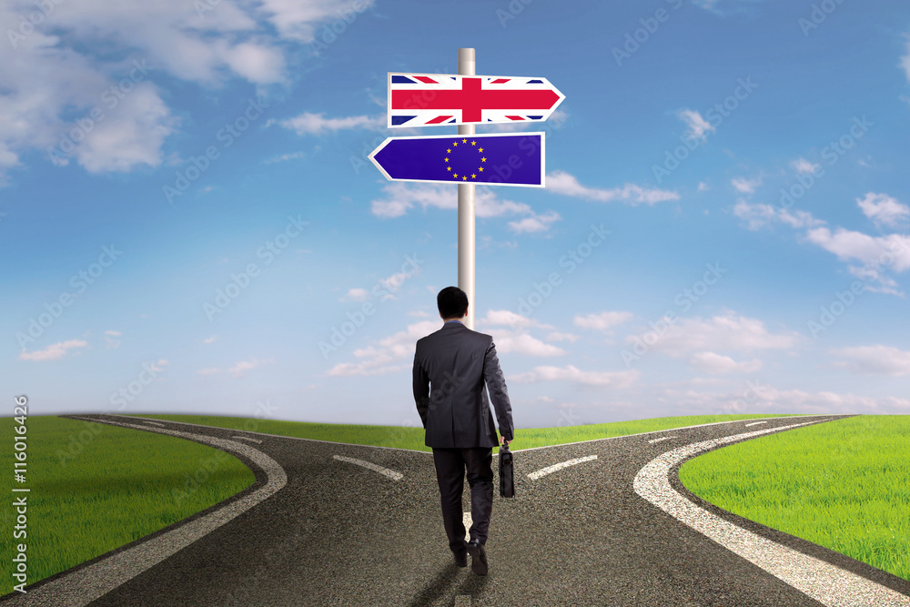 Businessman with brexit guidepost Businessman with brexit guidepost