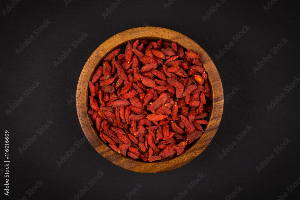 wooden bowl with goji berries