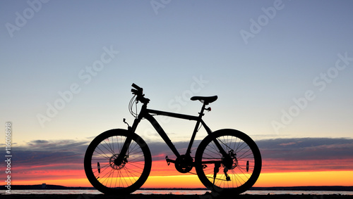 Bicycle against a sunset