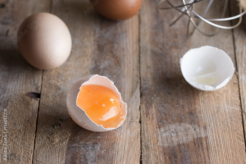 Raw eggs over wooden and rustic background Raw eggs over wooden and rustic background