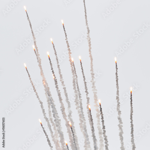 Billede på lærred Flares with a trial of smoke