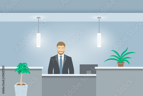 Young man receptionist stands at reception desk. Front view. Vector flat illustration. Office hall interior design with green plants and male administrator. Hotel registration background