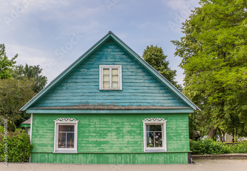 Traditional green and blue wooden house in Trakai