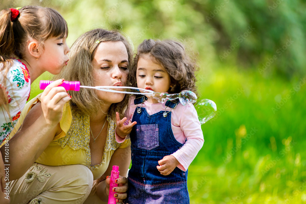 Family happiness and carefree concept. Family blowing bubbles Family happiness and carefree concept. Family blowing bubbles