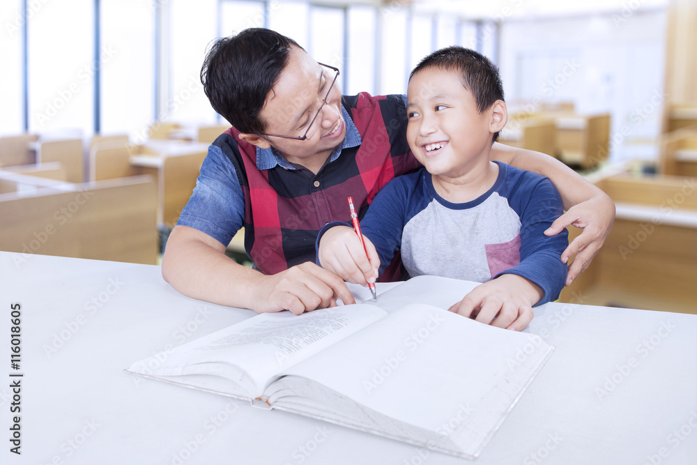 Teacher guide a student to doing schoolwork Teacher guide a student to doing schoolwork