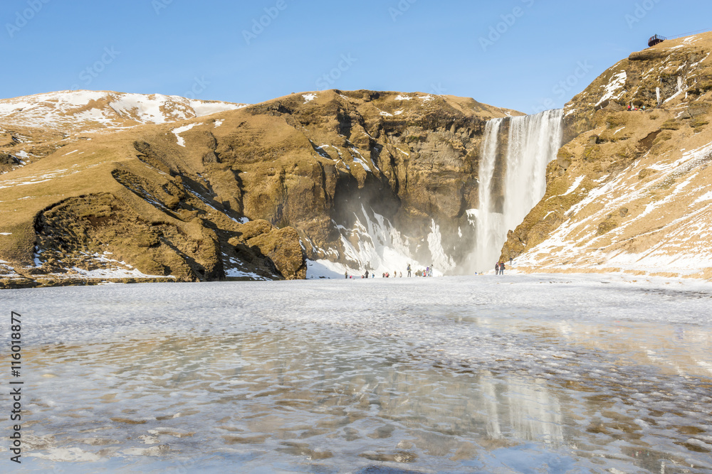 Fotografie Skogafoss waterfall in sunny day with reflection