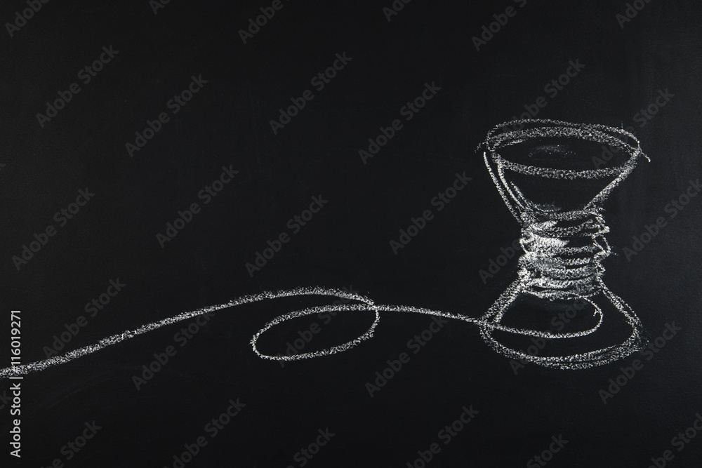 Fotografie Group of sewing objects lying flat on a black chalkboard backgro