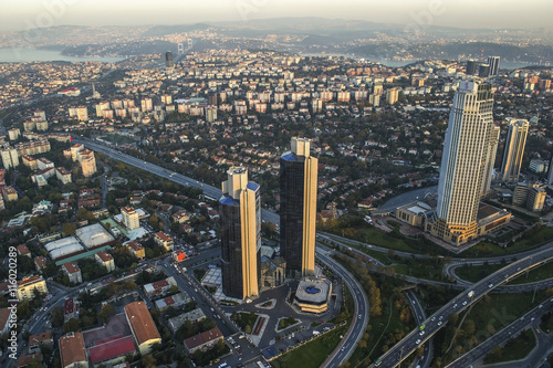 ISTANBUL, TURKEY - AUGUST 23: Skyscrapers and modern office buildings at Levent District. With Bosphorus background. August 23, 2014 in Istanbul, Turkey.