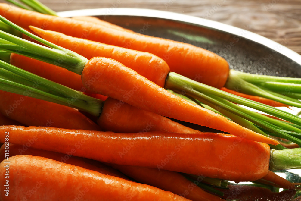 Carrots on metal plate, closeup Carrots on metal plate, closeup