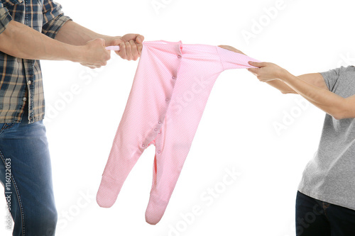Parents dividing children clothes, isolated on white