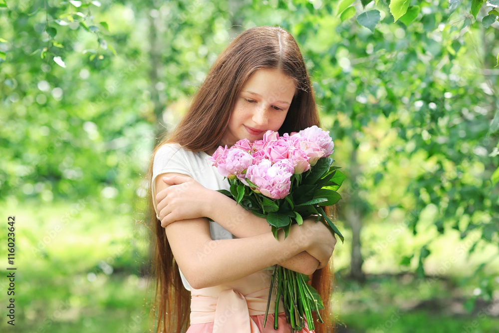 Beautiful girl with fresh bouquet in garden Beautiful girl with fresh bouquet in garden