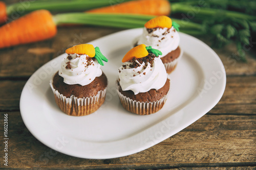 Carrot chocolate muffins on a white plate