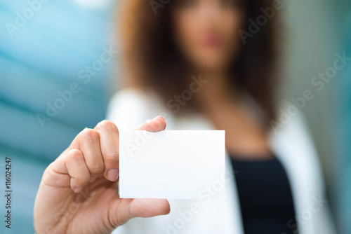Businesswoman showing a blank business card