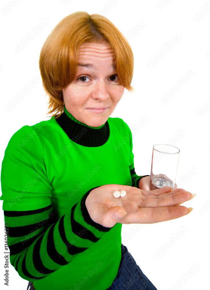 Girl with a glass and tablets