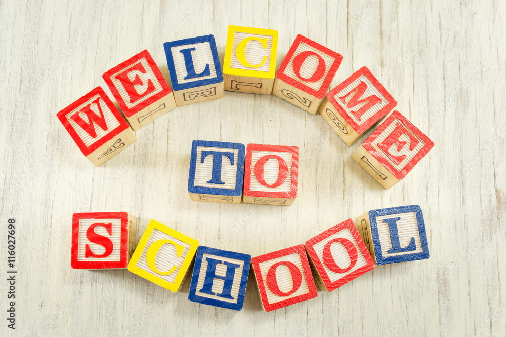 Welcome to school written in wooden cubicle letters Welcome to school written in wooden cubicle letters