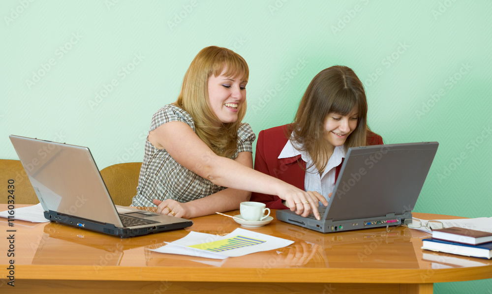 Girls work sitting at a table Girls work sitting at a table