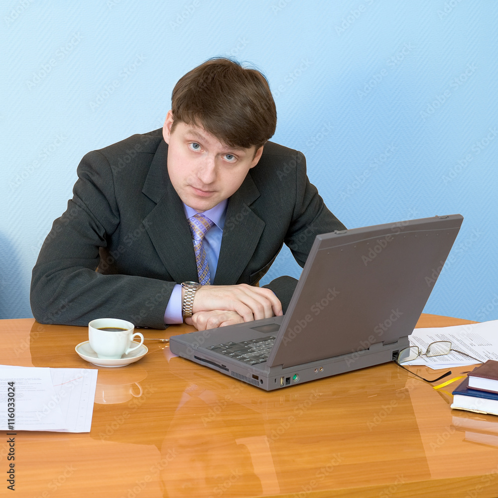 Businessman on a workplace with the laptop Businessman on a workplace with the laptop